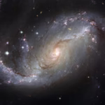 Capture of the NGC 1672 spiral galaxy showcasing its majestic spiral arms and bright core.