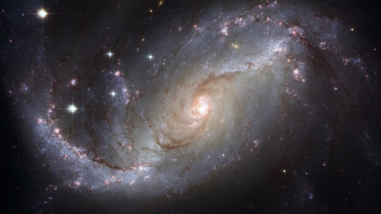 Capture of the NGC 1672 spiral galaxy showcasing its majestic spiral arms and bright core.
